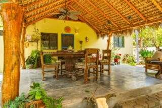 Todos Santos San Sebastian Nestled in the highly sought-after San Sebastian area of Todos Santos, this exceptional property offers the perfect blend of traditional Baja charm, comfort, and coastal living. Just one block from the beach, you'll enjoy the soothing sound of crashing waves throughout the day and evening, creating a peaceful backdrop unlike any other.The main residence is a spacious three-bedroom, two-bath home featuring a stunning traditional Mexican palapa roof that captures the authentic character of Baja. Designed for both comfortable living and entertaining, the home includes generous living and dining spaces, a dedicated laundry area, and ample storage. Outdoor living takes center stage with an expansive covered entertaining area complete with dining and lounge spaces, barbecue, pizza oven, and sparkling swimming pool--perfect for gathering with family and friends while enjoying the area's for sale