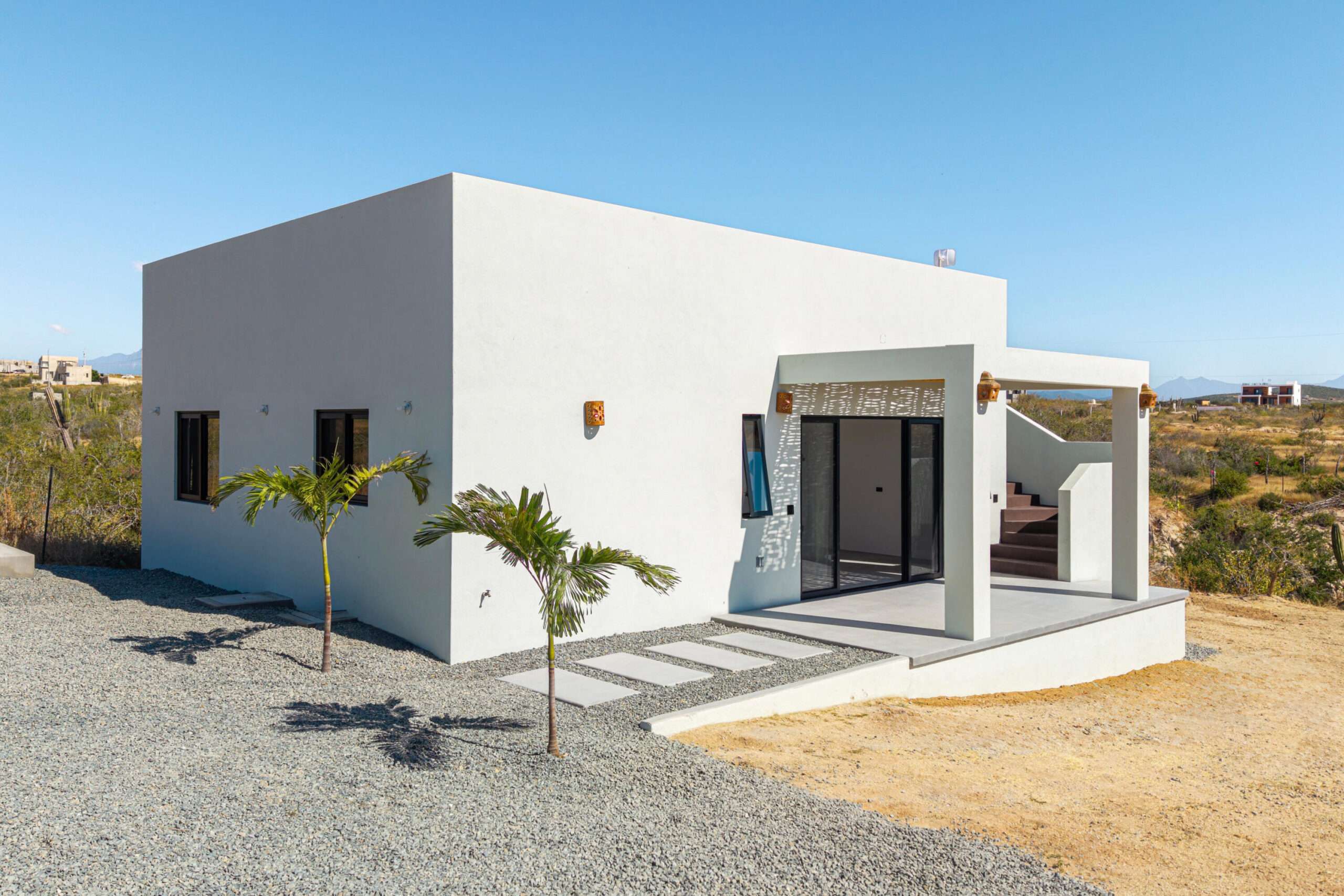 Todos Santos Las Tunas Immerse yourself in the vibrant colors of Mexico. Impeccably maintained two-bedroom, two-bath home with open floorplan is perfect for entertaining. Enter the home through the first of two private courtyards to discover a splashing fountain and a hand carved front door with wrought iron accents Polished Saltillo tile floors throughout lead from the spacious kitchen into the first of two living areas, enhanced with an intimate wood burning fireplace and casual equipal dining table and chairs. From there step into the spacious great room with wrap around windows highlighting sparkling ocean for sale