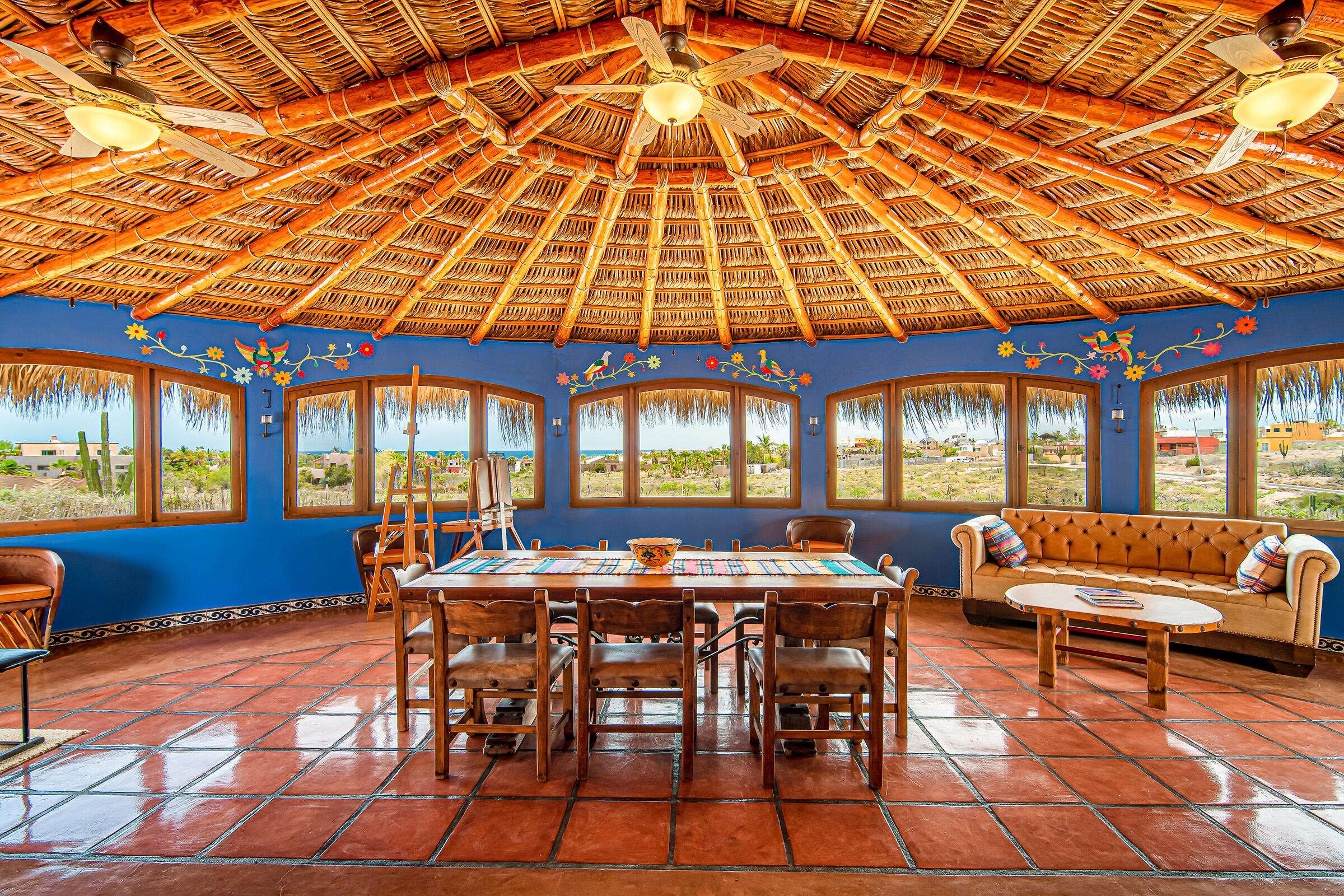 Todos Santos Las Tunas Immerse yourself in the vibrant colors of Mexico. Impeccably maintained two-bedroom, two-bath home with open floorplan is perfect for entertaining. Enter the home through the first of two private courtyards to discover a splashing fountain and a hand carved front door with wrought iron accents Polished Saltillo tile floors throughout lead from the spacious kitchen into the first of two living areas, enhanced with an intimate wood burning fireplace and casual equipal dining table and chairs. From there step into the spacious great room with wrap around windows highlighting sparkling ocean for sale