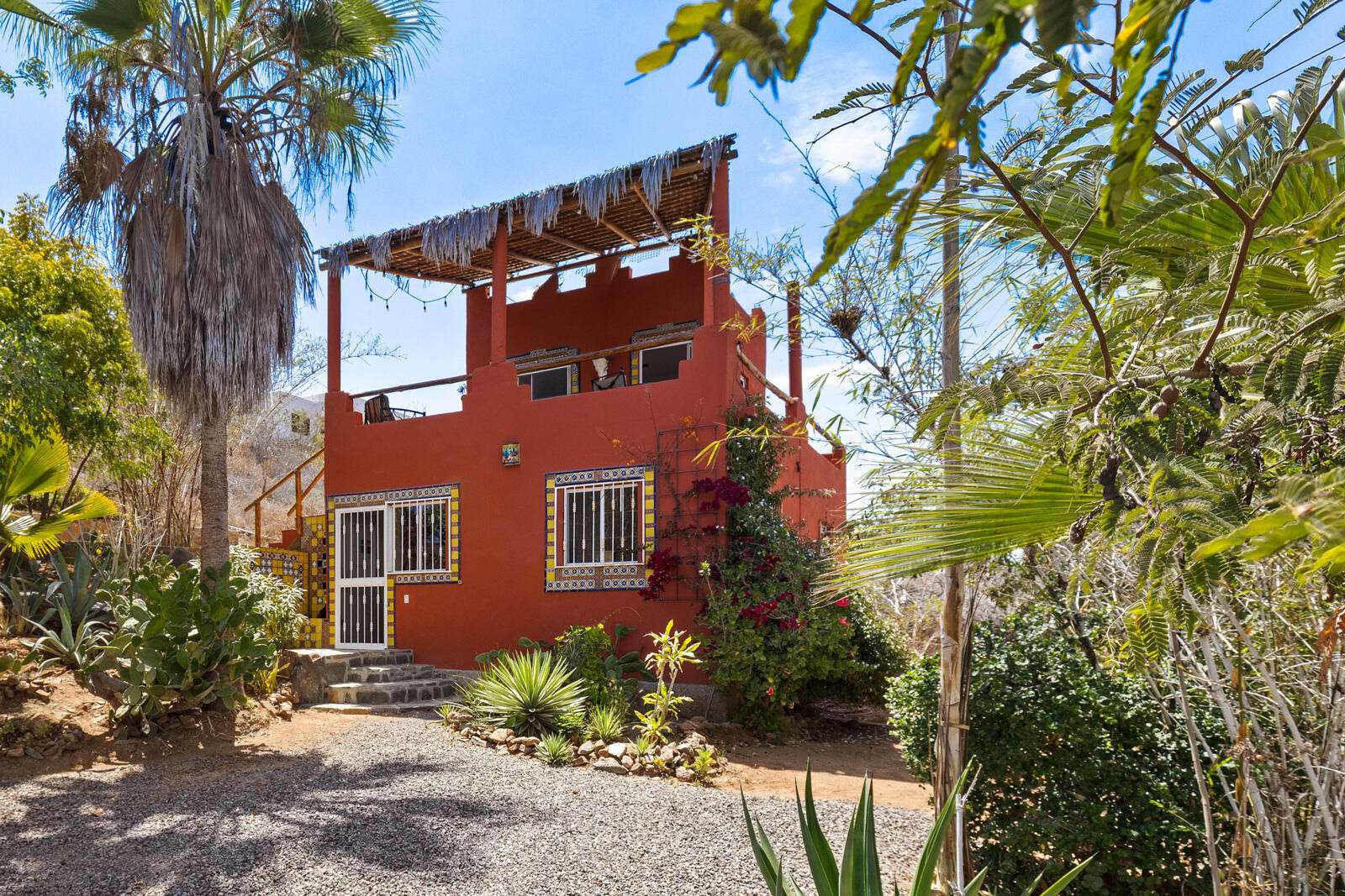 Todos Santos Todos Santos-General Welcome to Casa Santos, a sweet two bedroom casa with room to expand and make it your own! Located on the hillside of the San Vicente neighborhood, it's walking distance to the beautiful El Mirador restaurant and El Faro beach club - as well as downtown Todos Santos. The downstairs features an open living and dining area, with a large bedroom, living area, and full bathroom. The second bedroom and bathroom are upstairs with a large deck, and could easily be converted into a separate rental unit with the addition of a simple kitchen.There is plenty of space to add your own separate home or rental unit on the property, and currently there are two separate driveways, along with a lovely patio and chiminea fireplace. This home is ready to make your own or use as rental income. for sale