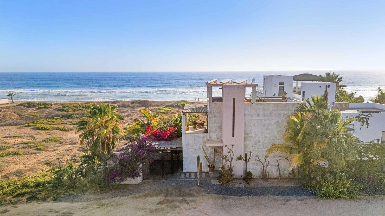 Todos Santos Cerritos Casa Cinco Flores blends contemporary Mexican design with the relaxed charm of Baja. Located on the pristine southern stretch of Cerritos Beach, this beachfront retreat offers direct beach access and swimmable waters away from the main crowds. The home features dual primary suites, each with an en-suite bathroom, private deck, and breathtaking ocean for sale