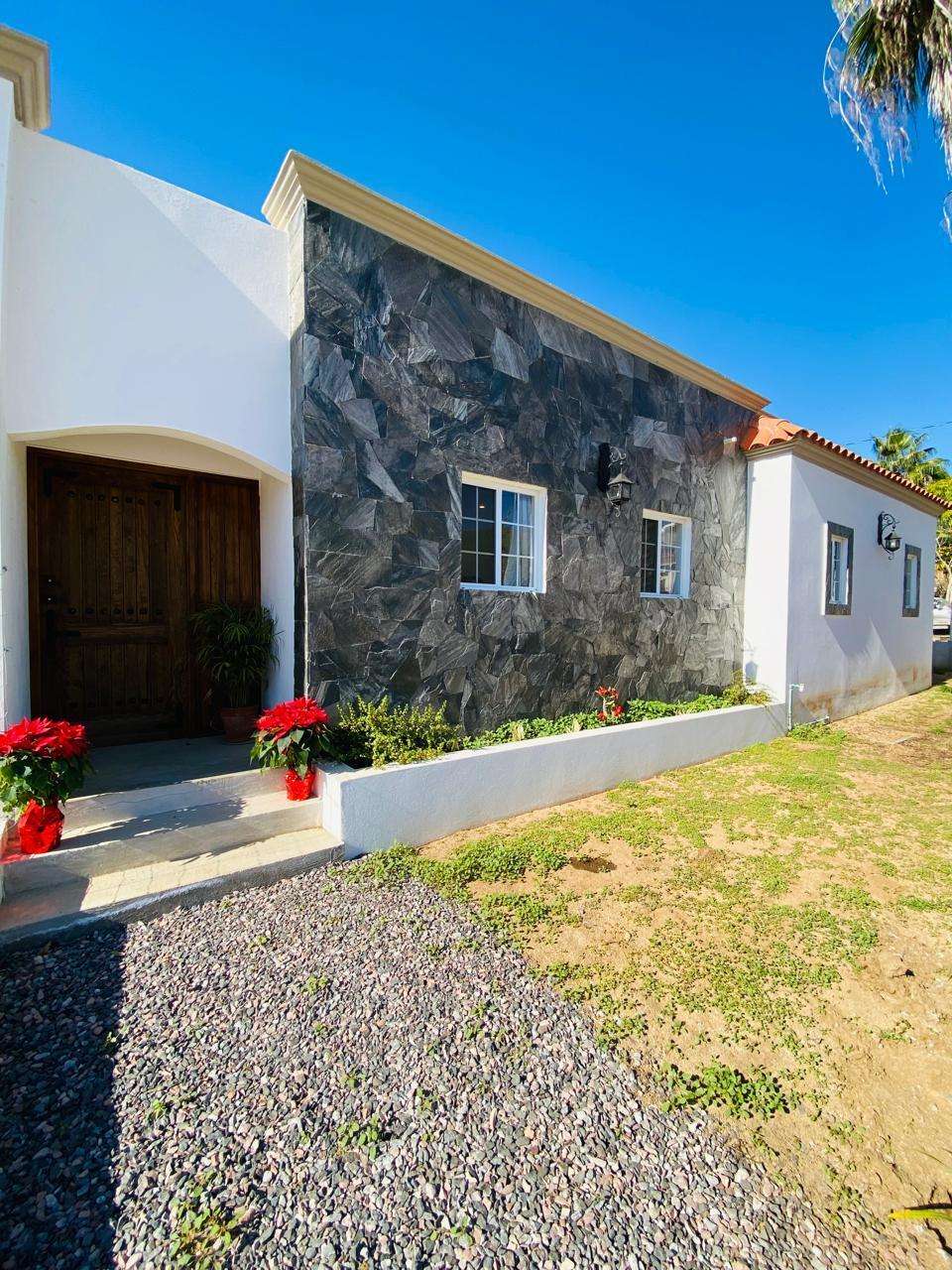 Todos Santos Centro-Todos Santos This brand-new, traditional-style home blends modern design with authentic Mexican charm. The residence features an open floor plan with double access to an expansive terrace, along with a spacious primary bedroom and ensuite bath. The kitchen is the heart of the home, where tradition and functionality blend into a warm and inviting space. With a central island, with talavera accesnts, that invites you to cook and share, this kitchen is perfect for those who love the art of cooking. Situated on a corner lot, the property offers dual access points via the main garage and the rear of the home. The grounds are beautifully landscaped with lush, mature greenery.Located in one of the most well-established neighborhoods in Todos Santos, this home is just a 10-minute walk from downtown. for sale