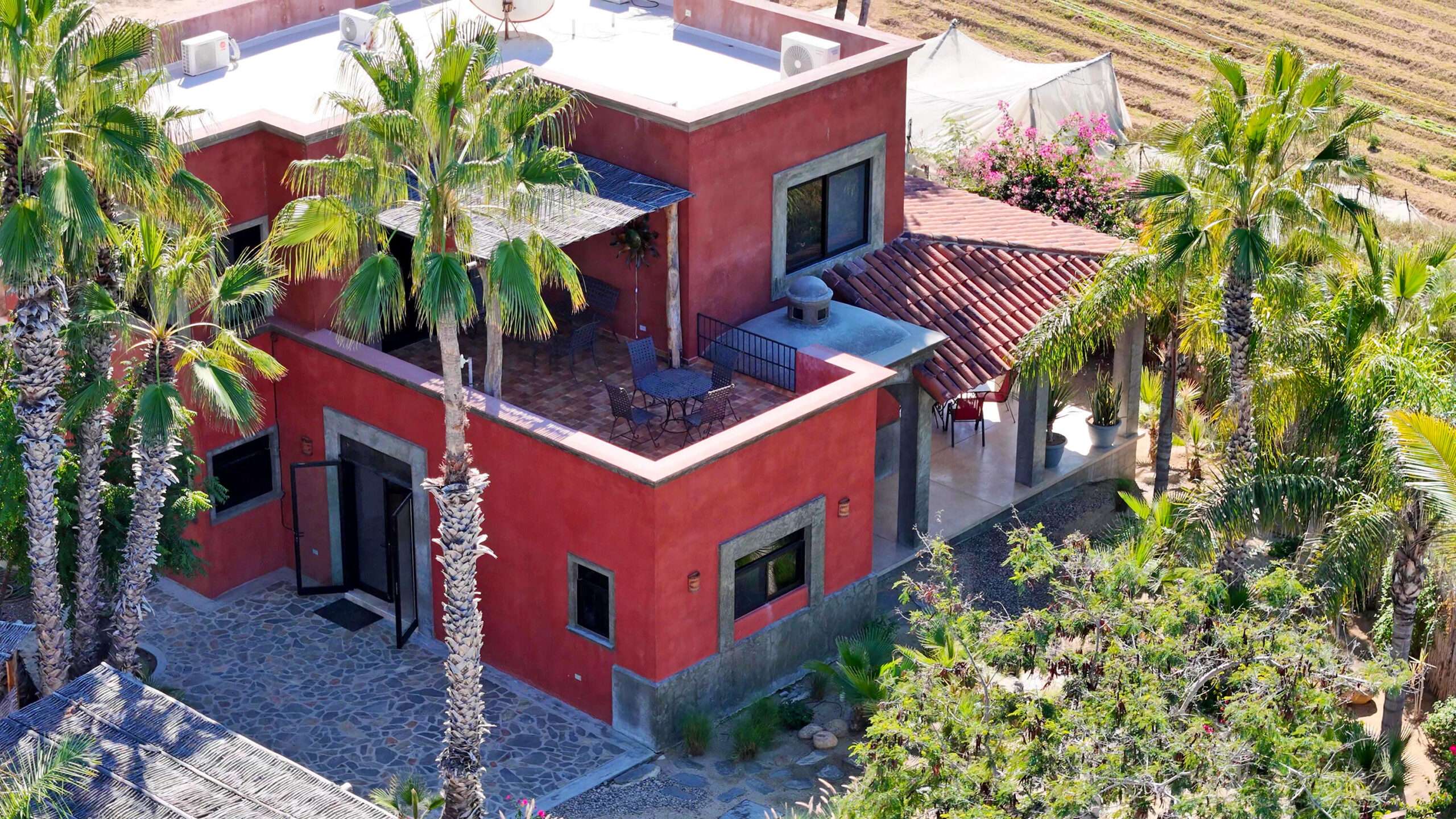 Todos Santos Los Jardines Huertas al Mar is a beautifully crafted home that captures the essence of Baja living. Quality finishes shine throughout, including Talavera floors, a striking bóveda entry, custom hardwood cabinetry with forged iron accents, and hammered copper details in the kitchen and baths. The open floor plan and screened doors invite fresh breezes and effortless indoor-outdoor living, leading to spaces designed to enjoy ocean and mountain for sale