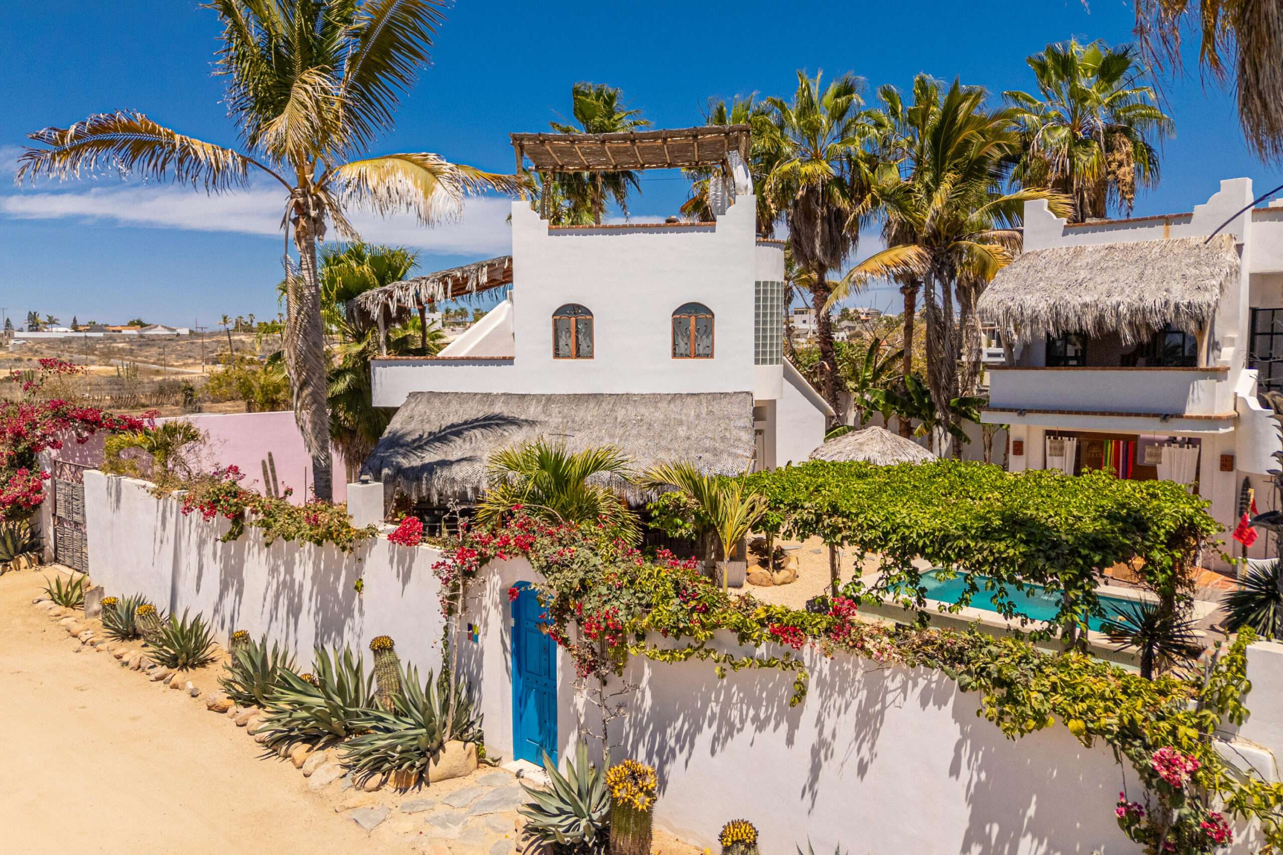 Todos Santos Las Tunas Behind the walls of this Las Tunas compound, Baja life unfolds with style, soul, and a quietly irresistible sense of escape. Equal parts bohemian chic hideaway and design forward retreat, this one-of-a-kind property captures the creative spirit of Todos Santos with a look and feel that is effortlessly cool, deeply personal, and impossible to replicate. A little bit Mexi, a little bit Mediterranean - 100% unforgettable. Property Highlights:" Main House: Saltillo tile floors, colorful Mexican accent tile and inviting interiors with a cozy, hip and authentic feel" Primary Suite: King bed, en-suite bathroom, spacious covered terrace and rooftop deck with panoramic ocean for sale