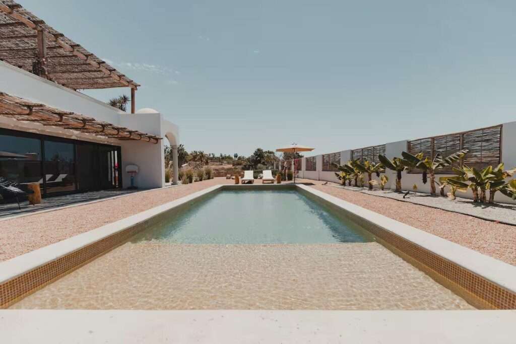 Todos Santos Todos Santos-General Villa Serena is a contemporary residence in Todos Santos designed for both private enjoyment and income-producing vacation rental operation. Set on a 995 m² lot, the property offers 289 m² of total construction, including 180 m² of air-conditioned living space and 109.60 m² of decks and terraces.The home features three bedrooms, three full bathrooms, two half bathrooms, a dedicated office, open-concept living and dining areas, a fully equipped kitchen, private swimming pool, sauna, outdoor fireplace and parking for up to four vehicles. Currently operating as a luxury vacation rental with an established Airbnb presence and Superhost status, Villa Serena offers a compelling opportunity for buyers seeking a high-quality second home or a turnkey investment asset in one of Baja – 23 Manzana 24, Pacific, BS