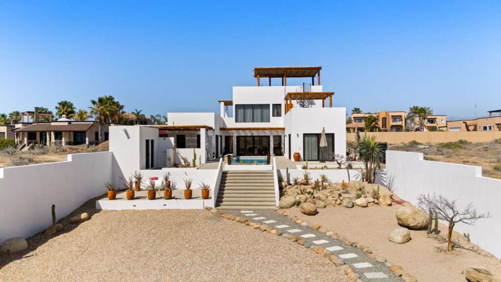 Todos Santos El Posito We are excited to introduce Casa Elisabeth, an amazing, newly constructed custom home in the private El Posito area of Todos Santos. Located just three rows back from the beach, this three-bedroom, three-full and two-half bathroom residence offers every amenity desired for a tropical paradise. The downstairs features an open-concept living room, dining room, and a fully stocked kitchen with brand-new appliances, including a dishwasher. The main floor also includes a laundry room and an outdoor water feature with a professionally designed rock wall. The principal bedroom downstairs offers a unique indoor/outdoor bathroom with two showers and an outdoor bathtub.Each of the three bedrooms includes an en-suite bathroom with double vanities. The upstairs bedroom features its own private furnished terrace and access to one of four large patios, complete with a bar area and outdoor furniture perfect for enjoying ocean sunsets. Additionally, a shaded third-floor observation deck provides panoramic ocean and mountain – Casa Elisabeth, Pacific, Pacific, BS