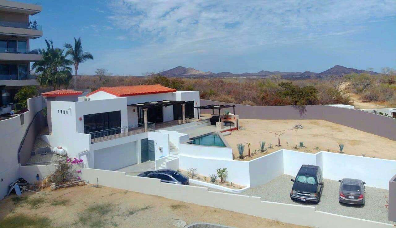 Todos Santos El Posito We are excited to introduce Casa Elisabeth, an amazing, newly constructed custom home in the private El Posito area of Todos Santos. Located just three rows back from the beach, this three-bedroom, three-full and two-half bathroom residence offers every amenity desired for a tropical paradise. The downstairs features an open-concept living room, dining room, and a fully stocked kitchen with brand-new appliances, including a dishwasher. The main floor also includes a laundry room and an outdoor water feature with a professionally designed rock wall. The principal bedroom downstairs offers a unique indoor/outdoor bathroom with two showers and an outdoor bathtub.Each of the three bedrooms includes an en-suite bathroom with double vanities. The upstairs bedroom features its own private furnished terrace and access to one of four large patios, complete with a bar area and outdoor furniture perfect for enjoying ocean sunsets. Additionally, a shaded third-floor observation deck provides panoramic ocean and mountain for sale