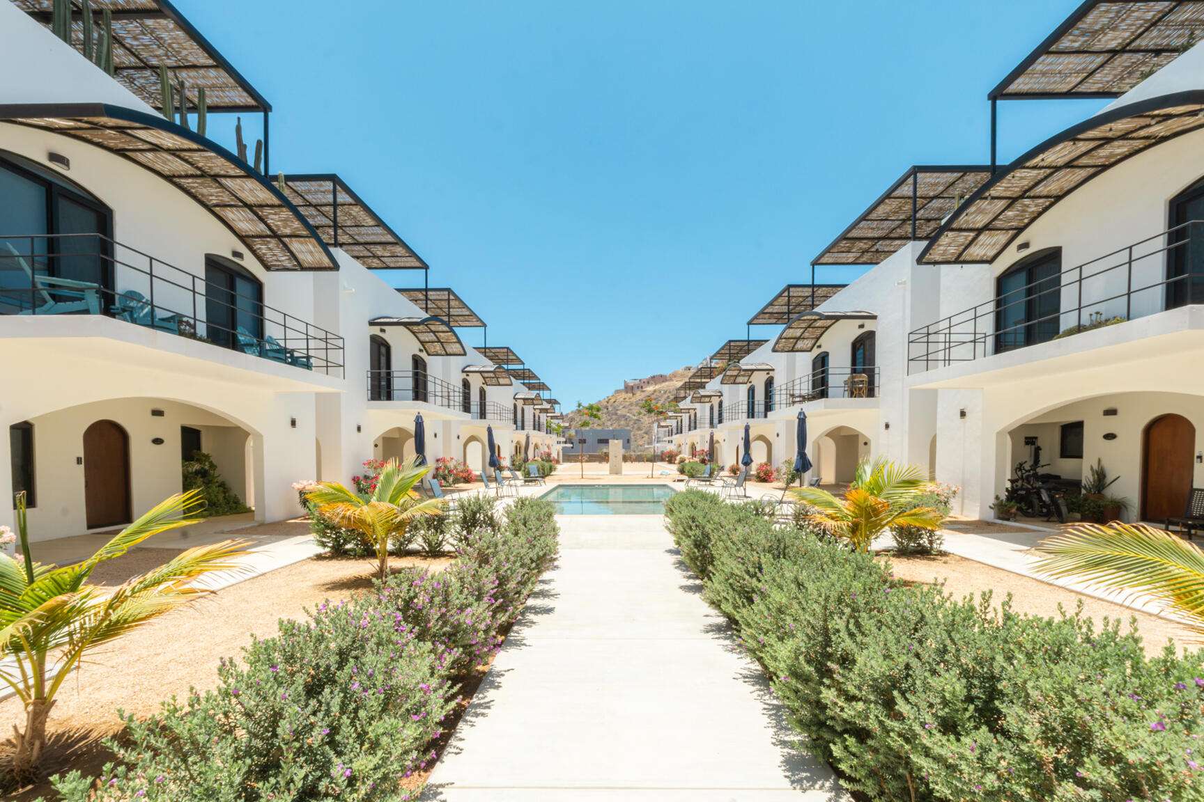 Todos Santos Salt Breeze Welcome to Unit 110-A, a beautifully designed residence at Salt Breeze Phase 2, where contemporary architecture, quality construction, and the relaxed Baja lifestyle come together just minutes from Cerritos Beach.Situated within one of the area's most exciting residential communities, this pre-construction home is surrounded by completed and actively developing residences, offering buyers the confidence of purchasing within an established neighborhood. With only three homes remaining, Unit 110-A presents a rare opportunity to own in Salt Breeze Phase 2. Designed for effortless indoor-outdoor living, this 3-bedroom, 3-bathroom residence offers approximately 2,230 sq. ft. (207 m²) of thoughtfully planned living space. The bright open-concept main floor combines the living room, dining area, and gourmet kitchen into one inviting gathering space. High-quality finishes, custom cabinetry, quartz countertops, and a large center island create both functionality and style, while the attached private garage provides secure parking and additional convenience.The upper level offers a spacious primary suite with its own private bathroom, accompanied by two guest bedrooms and an additional full bathroom. Every room has been designed to maximize comfort, natural light, and the effortless flow that defines modern Baja living.The highlight of the home is the expansive rooftop terrace, an ideal setting for entertaining or simply enjoying the outdoors. Featuring a private plunge pool and generous lounge space, the rooftop can also be enhanced with optional features such as an outdoor kitchen, jacuzzi, fire pit, or bar, allowing owners to create a truly personalized retreat.Salt Breeze residents enjoy beautifully landscaped common areas centered around a resort-style swimming pool, all just a short stroll from Cerritos Beach, renowned surfing, restaurants, cafés, and the laid-back atmosphere that continues to attract homeowners and visitors from around the world.Whether as a permanent residence, seasonal escape, or income-producing investment, Unit 110-A offers exceptional value in one of Baja California Sur's most sought-after beach communities.Included Features:Unit 110-A comes equipped with a 22 cu. ft. refrigerator, 5- or 6-burner gas range, microwave, dishwasher, washer and dryer, four mini-split air conditioning units, four ceiling fans, and natural gas connections on both the ground-floor patio and rooftop terrace. A larger refrigerator is available as an optional upgrade.Available Upgrades:Optional upgrades include sliding glass doors for the primary suite terrace, a rooftop jacuzzi, fully equipped outdoor kitchen, custom concrete fire pit with seating, concrete bar top, and backup generator rough-in. for sale