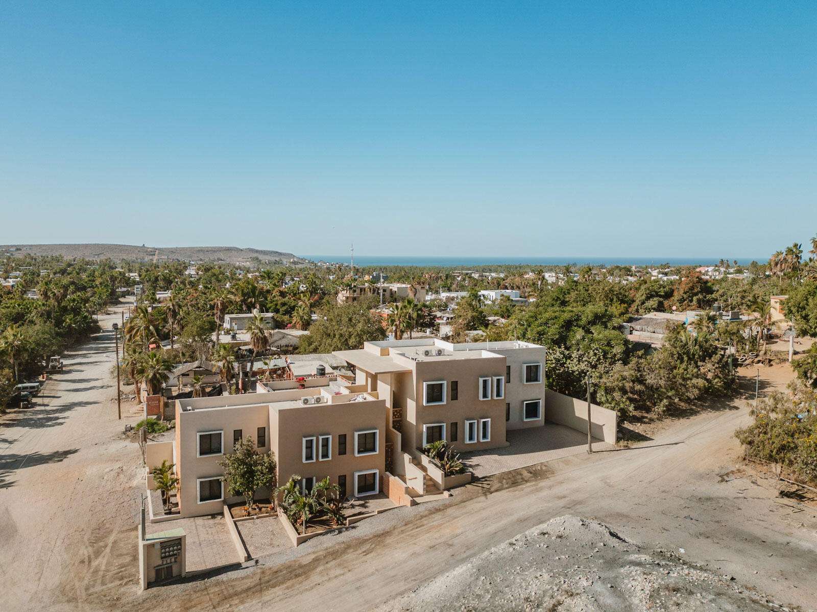 Todos Santos La Vibra La Vibra Urban ApartmentsA rare investment opportunity in Todos Santos, Baja California Sur, one of Mexico's most sought-after destinations. Located in a vibrant neighborhood just steps from paved roads and minutes from downtown, this boutique property offers a perfect balance of convenience and tranquility. This two-story building includes eight thoughtfully designed 1-bedroom, 1-bathroom apartments, featuring custom-made imported kitchens, modern lighting, and ceiling fans. The property provides secure access for peace of mind and a rooftop terrace with panoramic for sale
