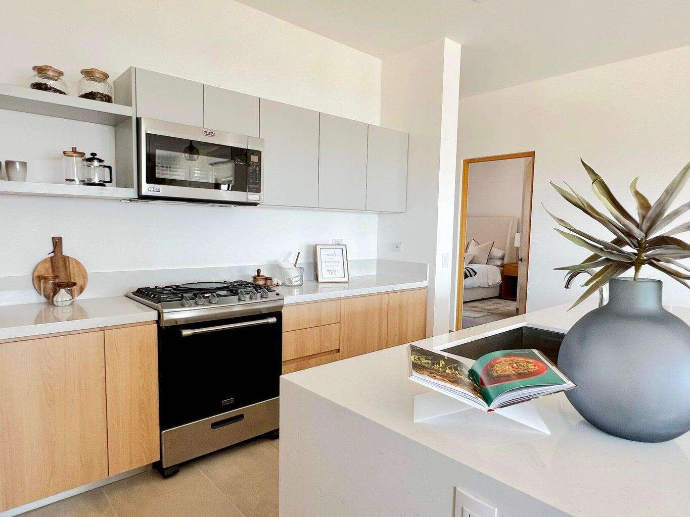 Todos Santos Villas De Cerritos Beach This charming two-story home blends comfort, modern style, and laid-back Baja beach living. From the moment you arrive, the well-kept landscaping and contemporary coastal architecture set the tone for a serene and welcoming atmosphere.Inside, an open-concept layout connects the living room, dining area, and kitchen, naturally lit by large windows that frame glimpses of the surrounding landscape. The neutral color palette and relaxed furnishings create an immediate sense of calm. The kitchen is modern and functional, featuring stainless steel appliances, ample counter space, and smart storage. A half bath on this level adds convenience for guests. Sliding pocket doors open onto a private patio with a pergola perfect for outdoor dining, sun lounging, and enjoying Baja's breezy afternoons. The garden area has been thoughtfully designed for intimate gatherings and immersing in nature.Upstairs, two of the three bedrooms offer peaceful sanctuaries. The primary bedroom includes an en-suite bathroom, while the other two share a modern full bath.But the real highlight awaits on the third-level roof deck a luxurious jacuzzi overlooking panoramic for sale