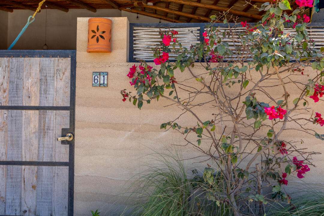 Todos Santos Villas De Cerritos Beach Discover Casa Tierra y Cielo (Casita 61), a beautifully crafted 2-bedroom, 2-bathroom home located in the sought-after community of Villas de Cerritos Beach. Just minutes from the pristine shores and world-class surf of Cerritos Beach, this inviting residence offers 947.11 sq. ft. of thoughtfully designed living space, seamlessly blending comfort, style, and functionality. Step inside to find a bright and airy open-concept living and dining area, complemented by a fully equipped indoor kitchen, perfect for entertaining or enjoying quiet moments at home. The home's rammed earth facade not only enhances its aesthetic appeal but also provides natural insulation, keeping the interior cool and comfortable for sale