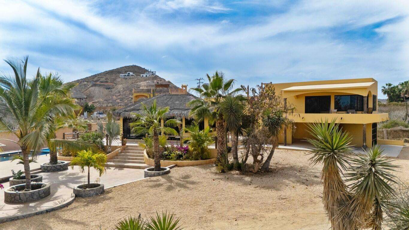 Todos Santos Cerritos Rare opportunity just minutes from Cerritos Beach! This charming Hacienda-style home sits in a fully walled compound with two vehicle gates, side access, and a garage, with ample room to expand. Enjoy a solar-heated pool, hot tub, expansive patios, and gorgeous mature landscaping that creates a private oasis. Incredible ocean and mountain for sale