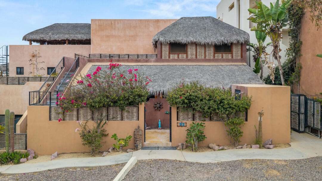 Todos Santos Villas De Cerritos Beach Discover a unique opportunity in the sought-after community of Villas de Cerritos Beach. Three Charming Casitas features three independent living spaces, including two identical ground-floor studios with private kitchens and covered outdoor terraces, plus a charming upper-level loft-style casita with its own kitchenette and spacious terrace. Designed with authentic Baja character, the property showcases traditional palapa roofing, handcrafted details, warm natural finishes, and inviting indoor-outdoor living spaces. Each unit offers privacy, comfort, and functionality, creating an ideal setup for vacation rentals, long-term tenants, or a combination of personal use and income generation.The two lower studios feature comfortable sleeping quarters, full bathrooms, kitchenettes, and shaded outdoor patios perfect for enjoying the relaxed Cerritos lifestyle. The upper loft-style casita offers an elevated sense of privacy, with an open-concept layout, palapa ceilings, and a generous terrace area.Located just minutes from Cerritos Beach, one of Baja Sur's premier surf and swimming destinations, the property enjoys access to the community's resort-style amenities, including a swimming pool, jacuzzi, and beautifully maintained common areas. Restaurants, cafés, and local attractions are all within easy reach.Whether you are seeking a turnkey vacation rental property, a flexible multi-unit investment, or a personal Baja retreat with exceptional income potential, Casa Tres Casitas presents a rare opportunity in one of the region's most desirable beach communities. for sale